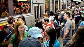 Boston commuters wait for the MBTA train